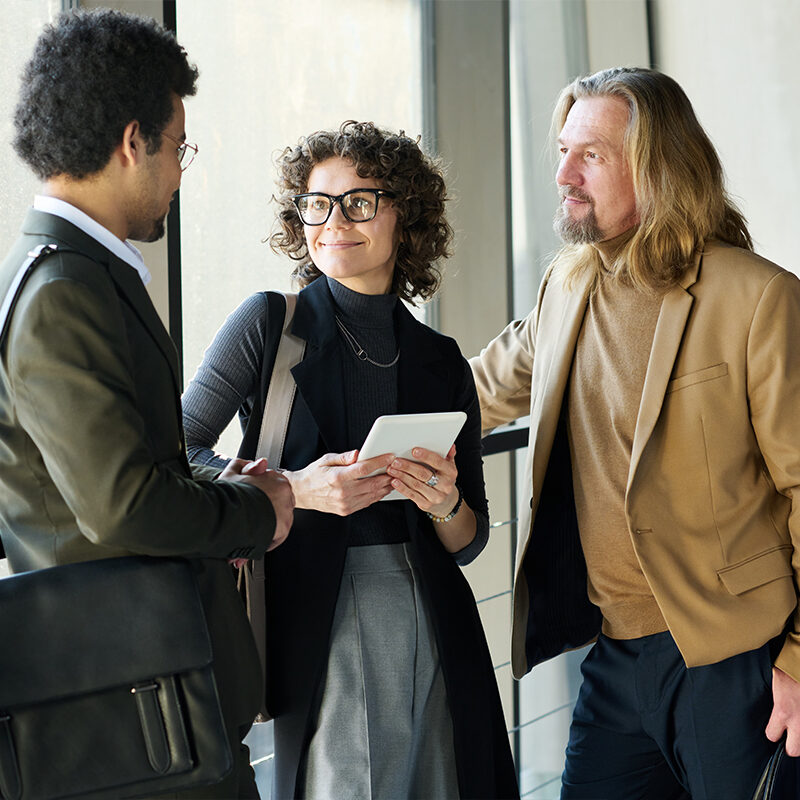 three-person-meeting-standing